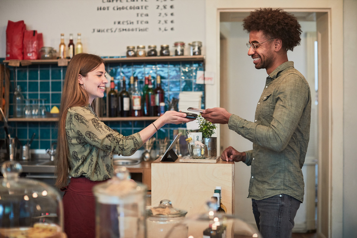 Young Adult Making A Purchase